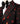 Smoking noir avec broderie de pierres rouges